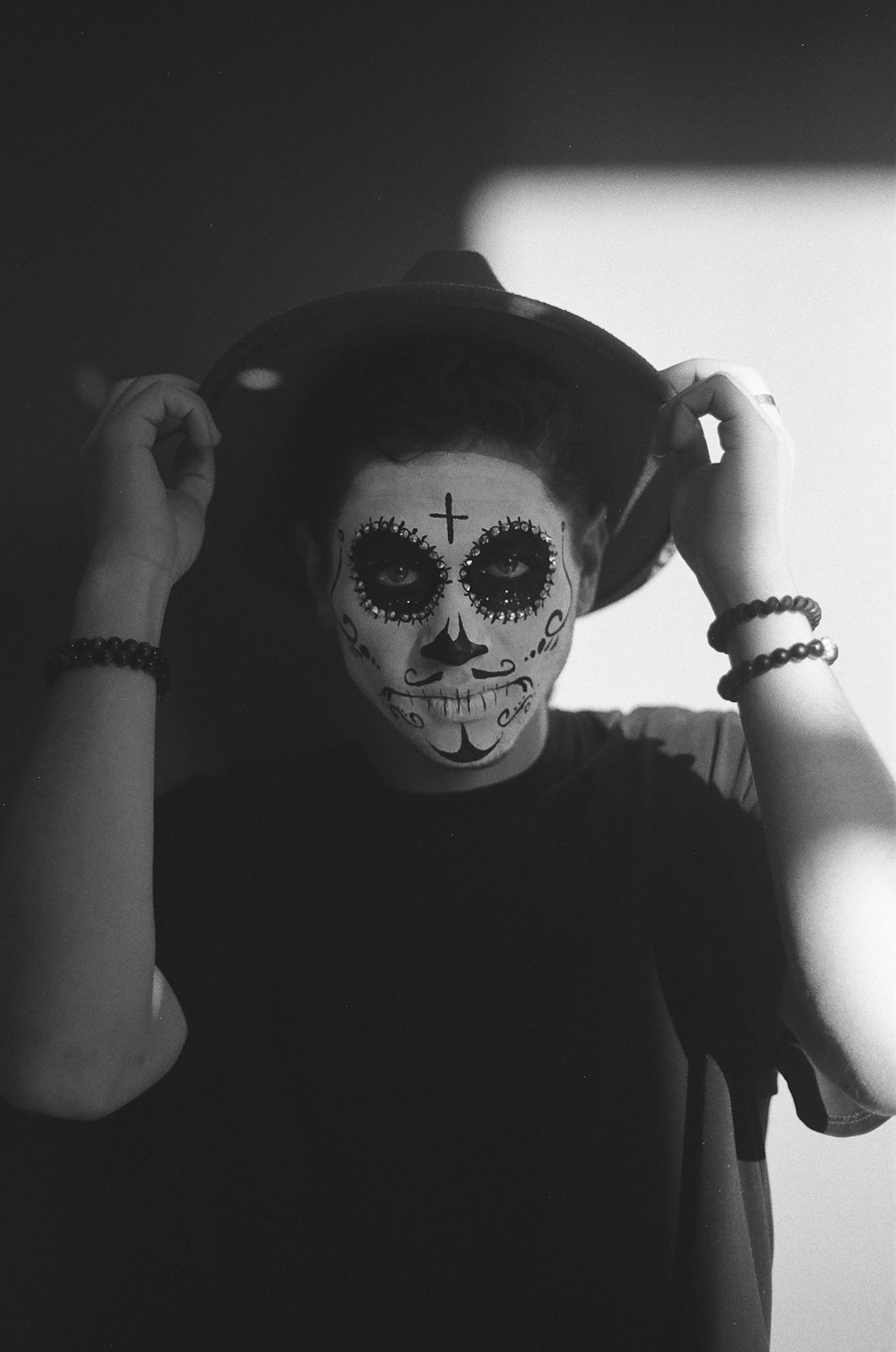 a person with a face painted like a skeleton