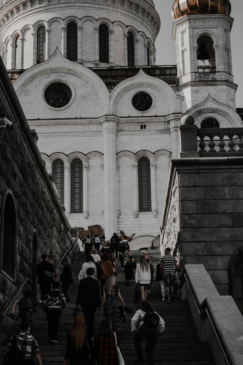 a group of people walking up a set of stairs