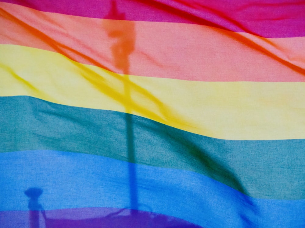 a close up of a rainbow colored fabric