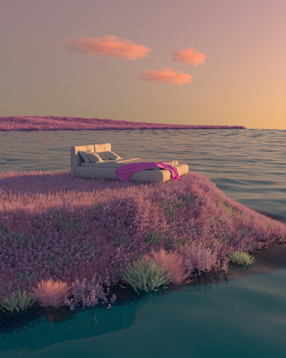 a couch sitting on top of a lush green field next to a body of water