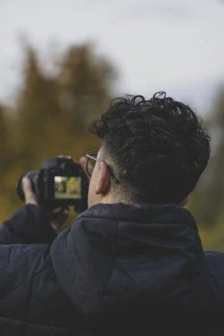 a man taking a picture with a camera