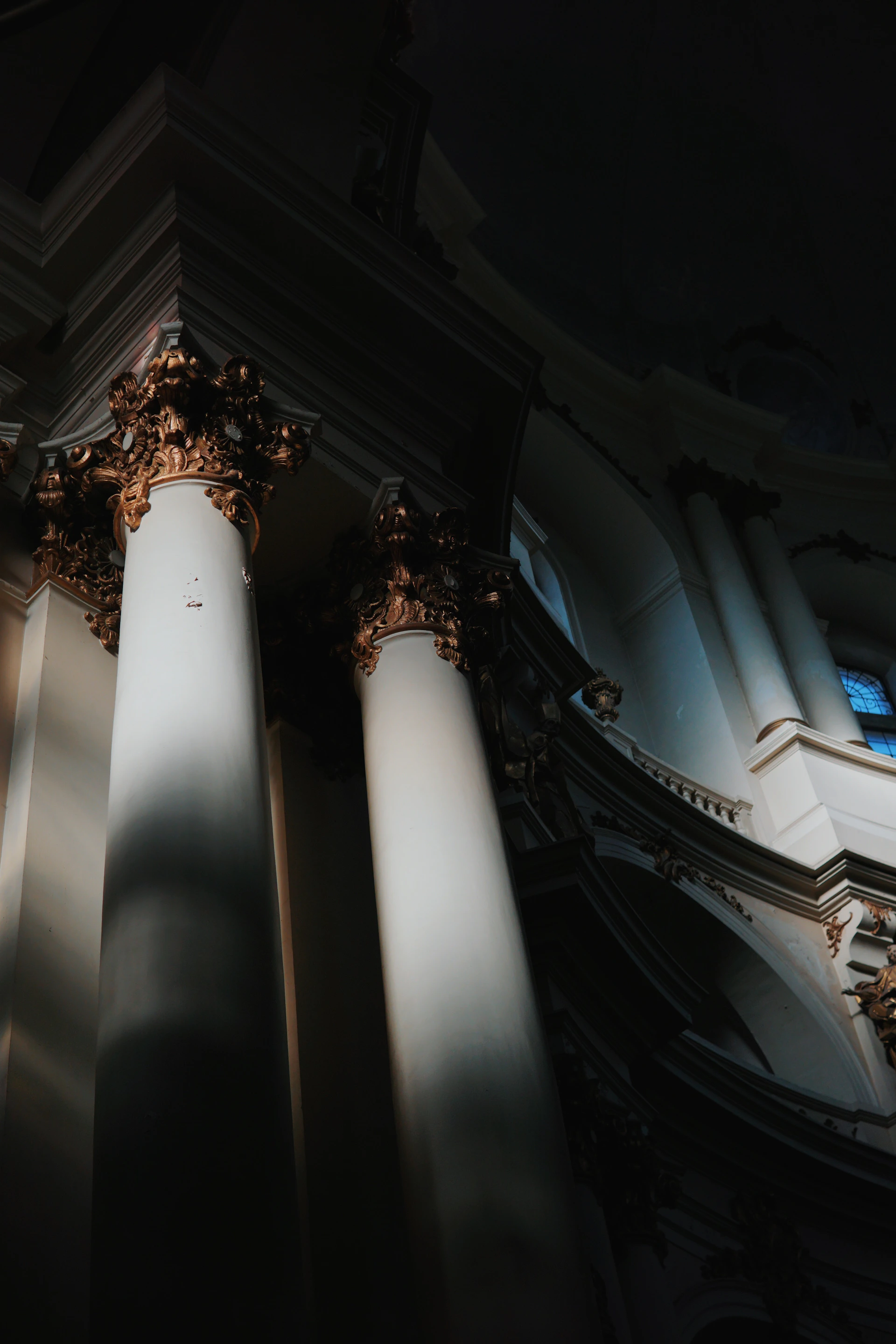 a couple of pillars in a building with a light shining on them