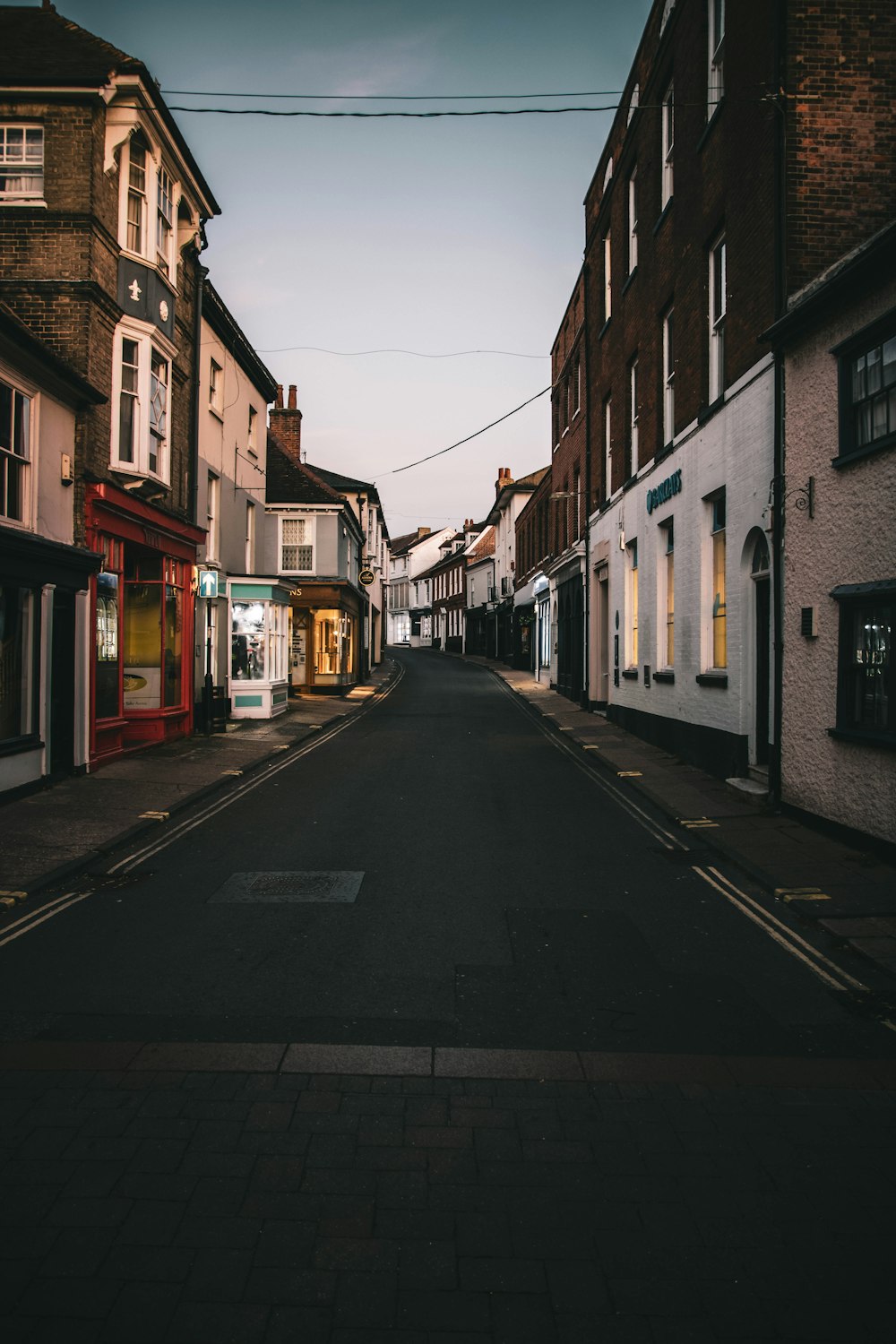 an empty street in a small town during the day