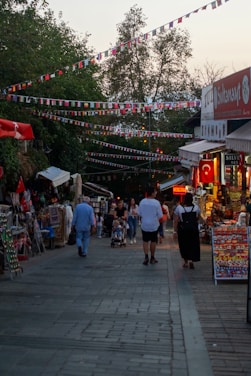 A bustling outdoor market scene with families enjoying fresh produce and live music.