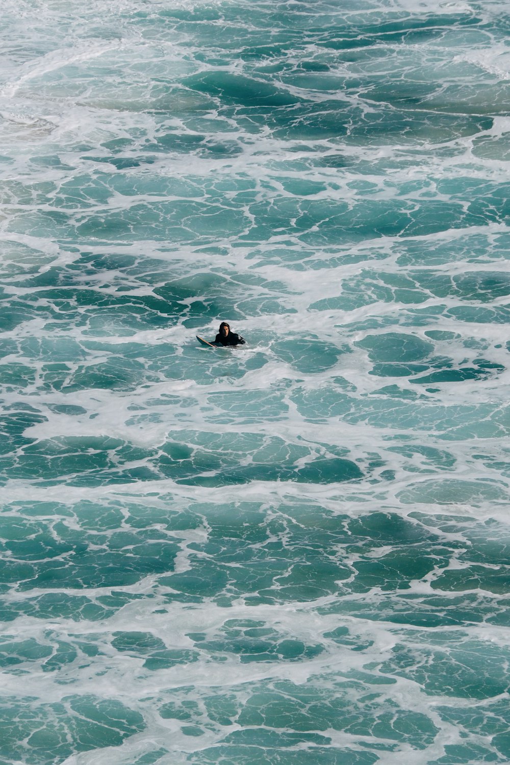 a person swimming in a body of water