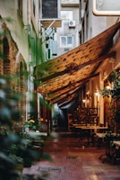 A hidden alley cafe with warm lighting and cozy wooden decor in Osaka