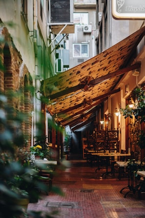 A hidden alley cafe with warm lighting and cozy wooden decor in Osaka