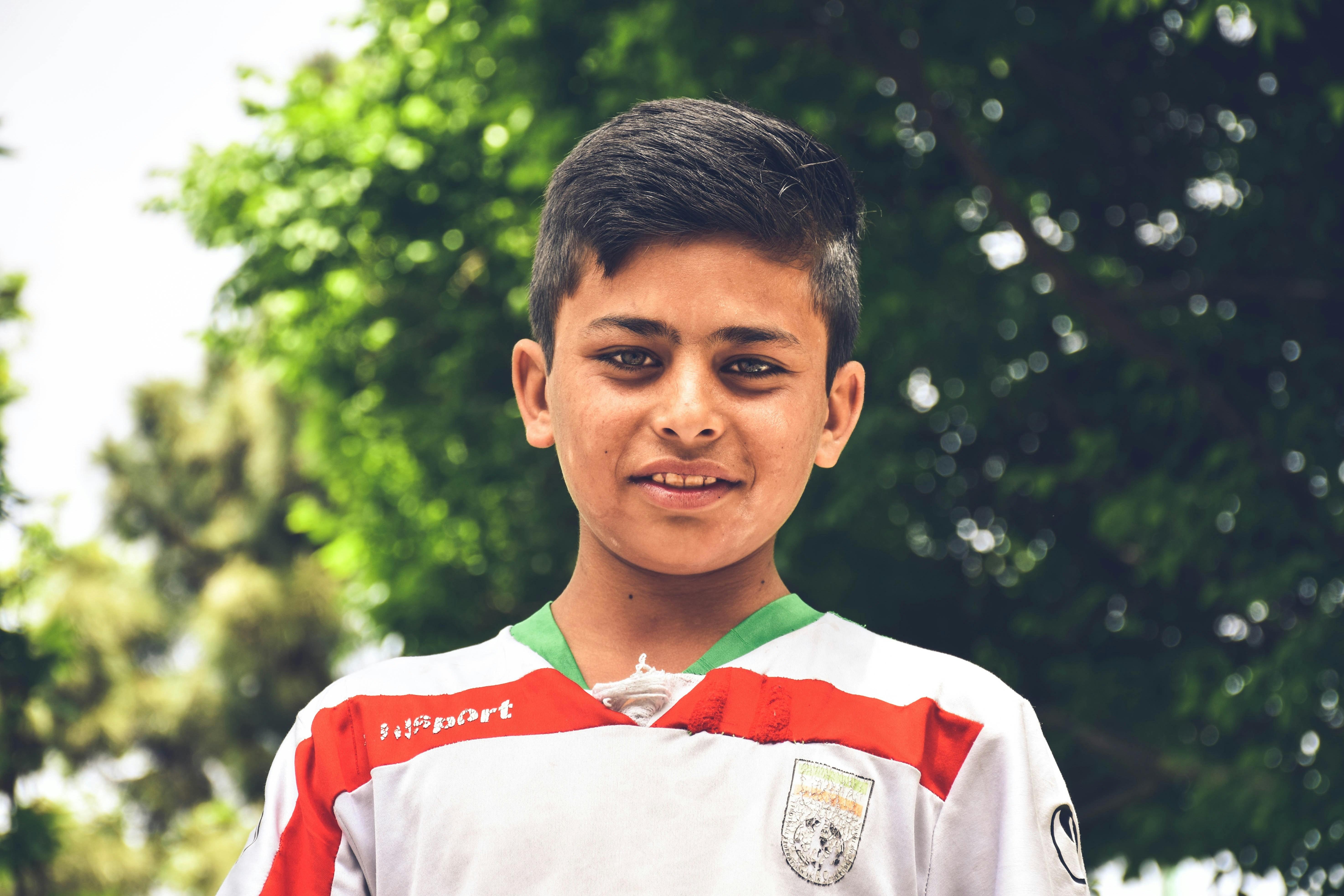 a young boy is posing for a picture