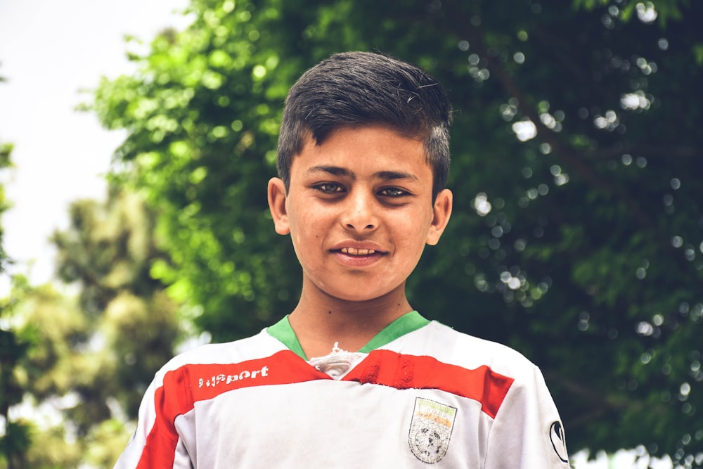 a young boy is posing for a picture