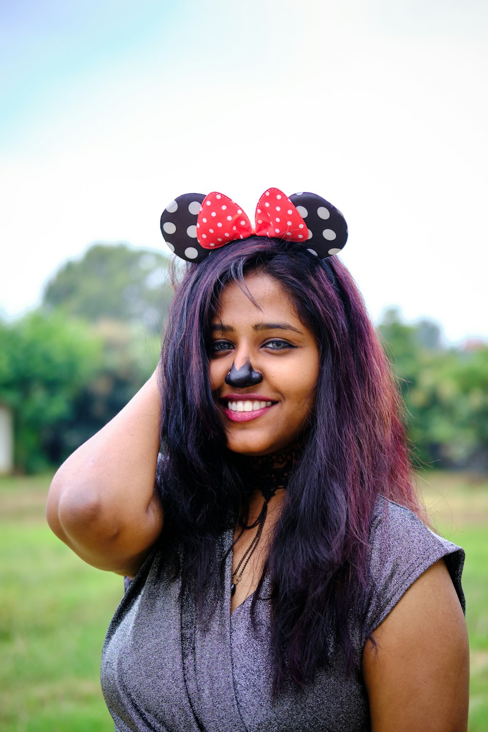 a woman with a minnie mouse ears on her head