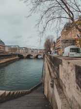 A scenic view of Avignon with a tow truck parked nearby.