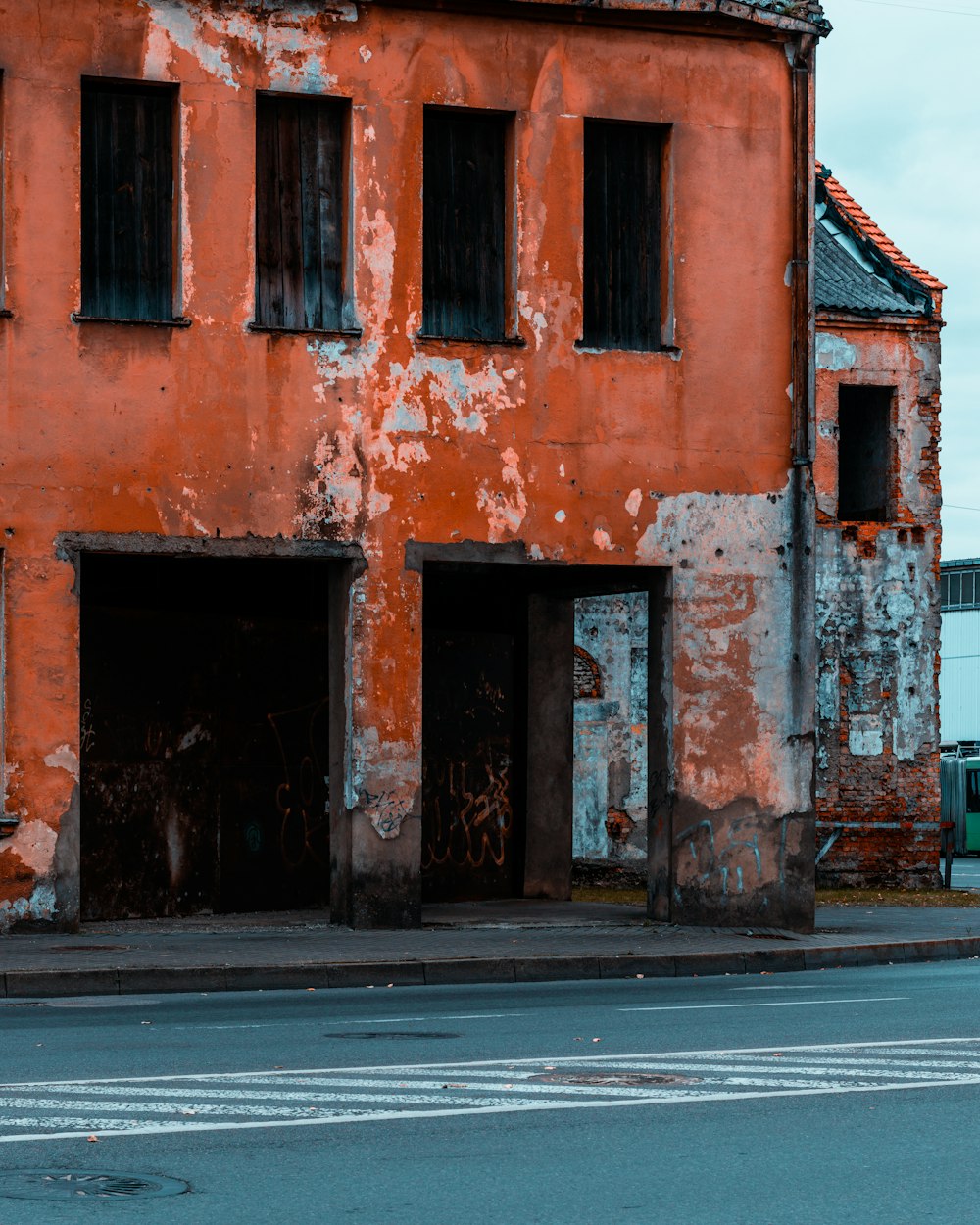 an old building with a broken down door