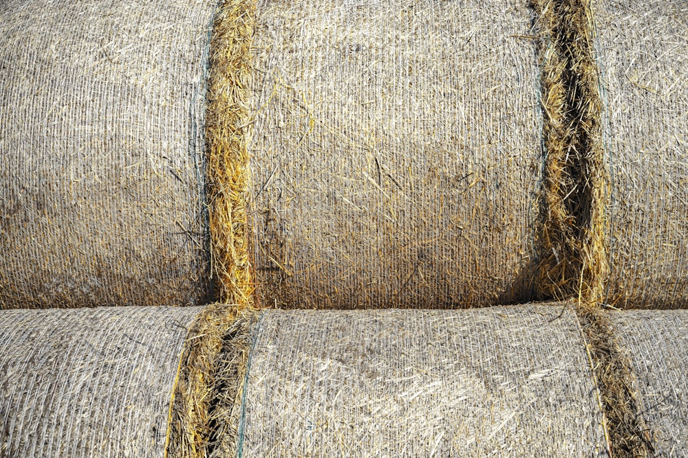 a close up of hay bales stacked on top of each other