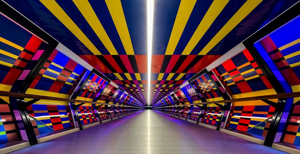 a very colorful hallway with a lot of lines on the ceiling