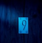 a sign that is on the side of a wooden wall