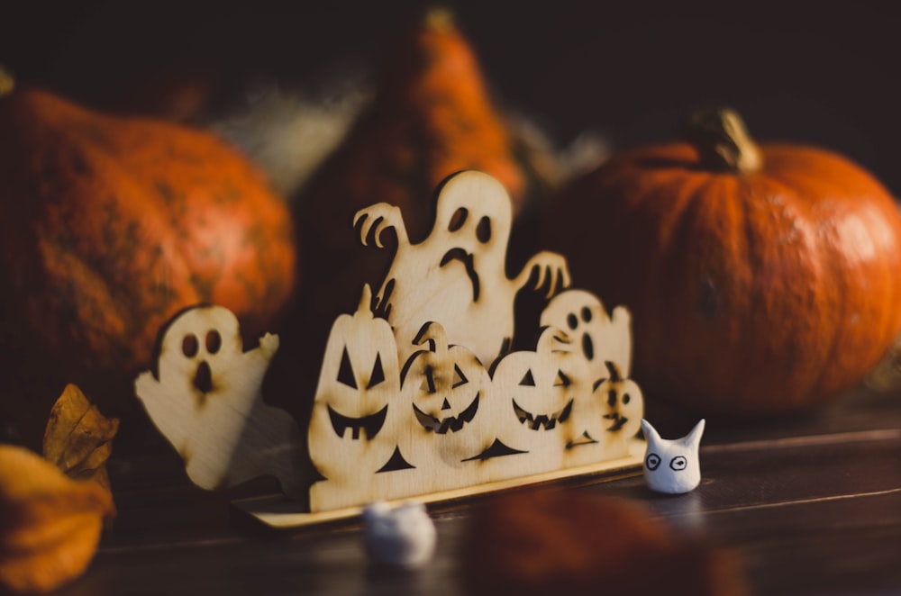 a group of carved pumpkins sitting on top of a table