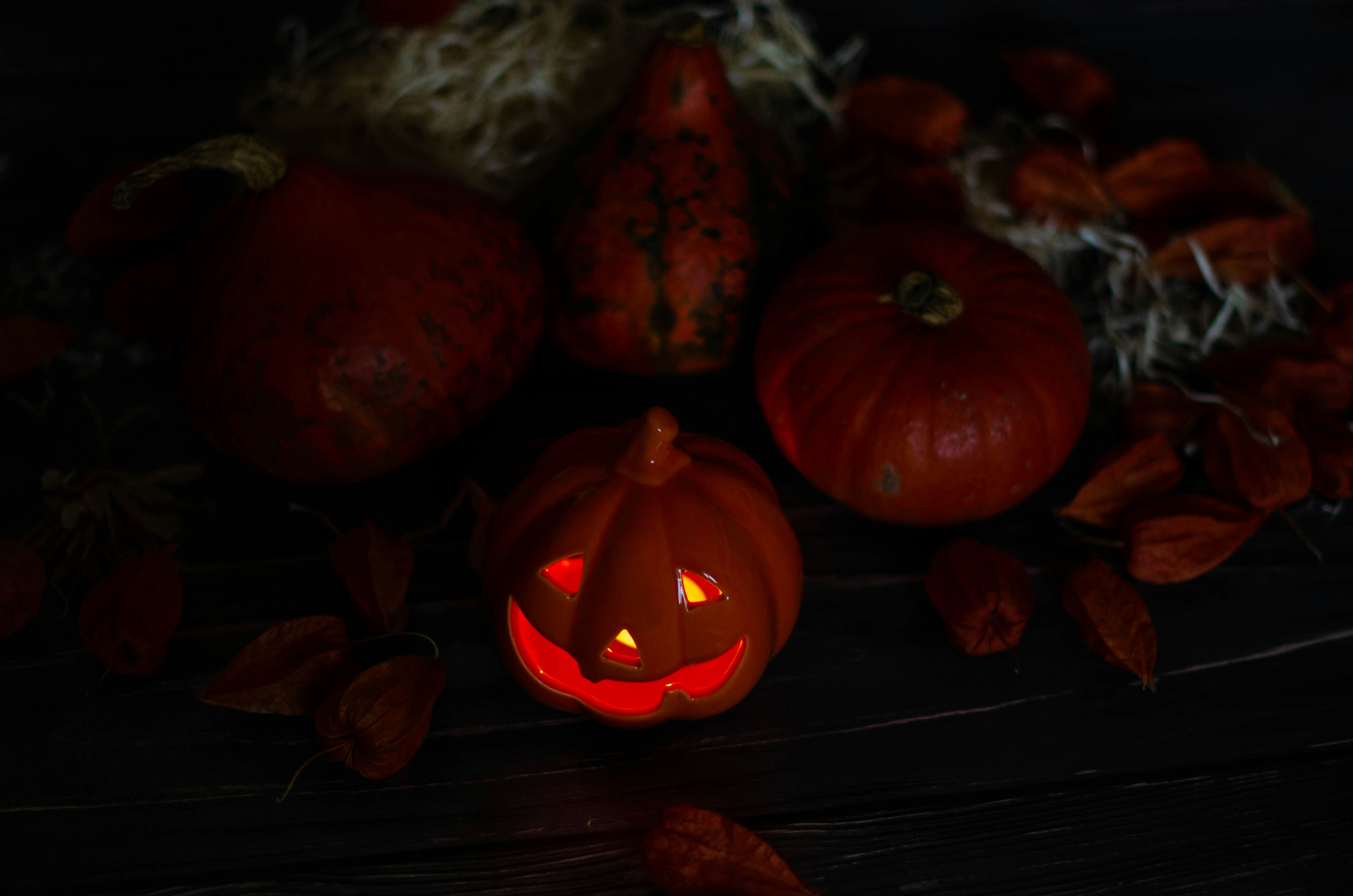 a carved pumpkin surrounded by other pumpkins