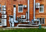 a building with a bunch of pipes on the side of it