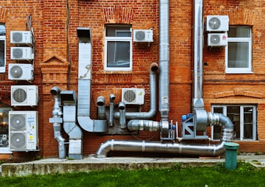 a building with a bunch of pipes on the side of it