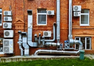a building with a bunch of pipes on the side of it