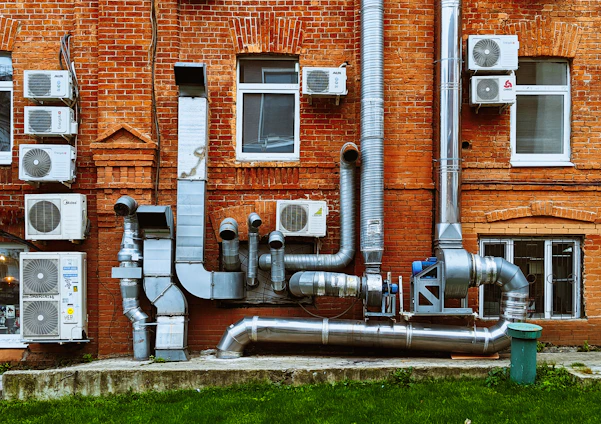 a building with a bunch of pipes on the side of it