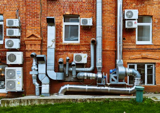 a building with a bunch of pipes on the side of it