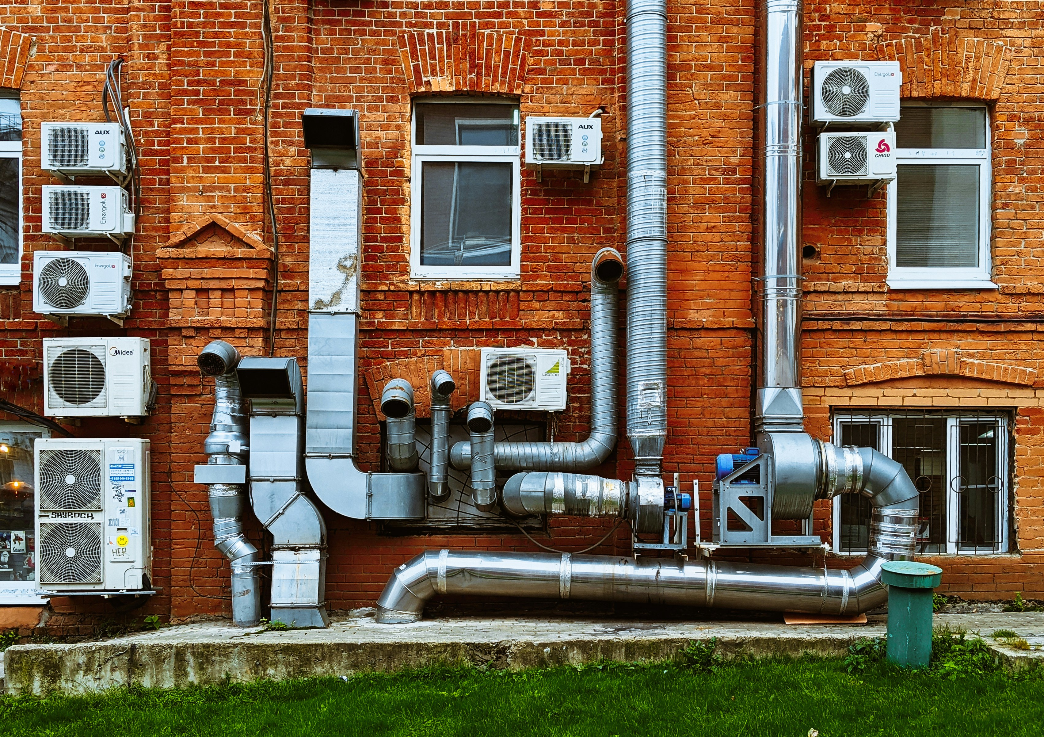 a building with a bunch of pipes on the side of it