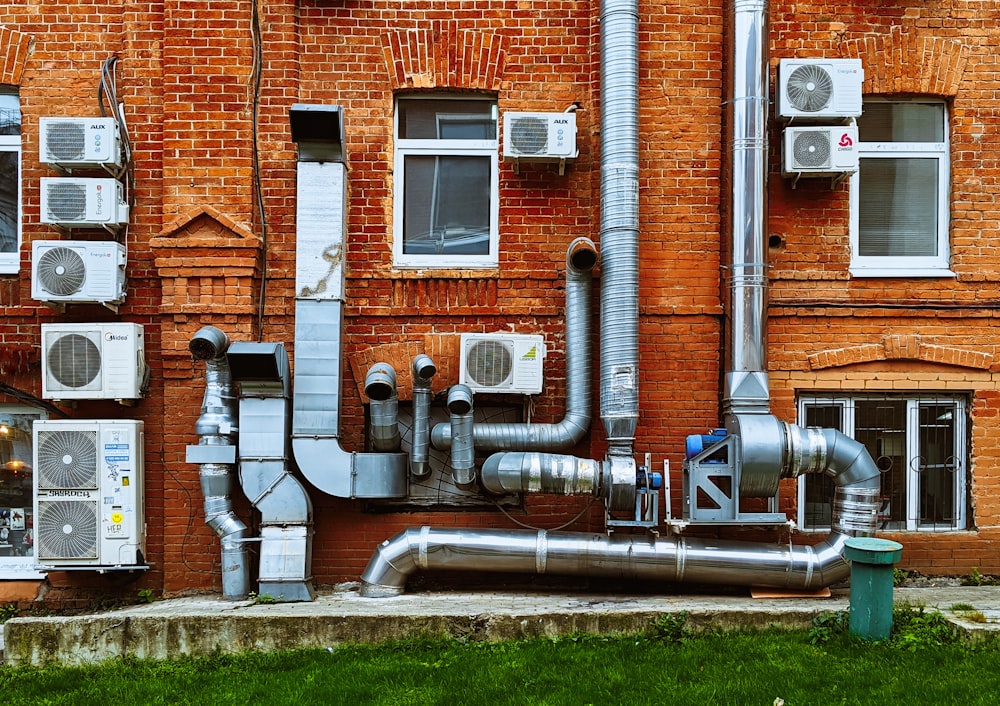 a building with a bunch of pipes on the side of it