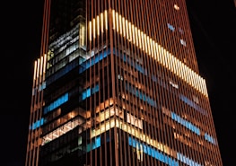 a very tall building lit up at night