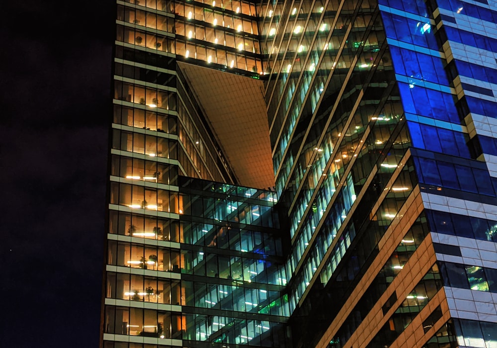 a very tall building with lots of windows at night