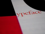 Text prominently featuring the word 'ypeface' written in red on a white background. The surrounding design includes blocks of contrasting colors, such as black and red, which create a bold and striking visual composition.