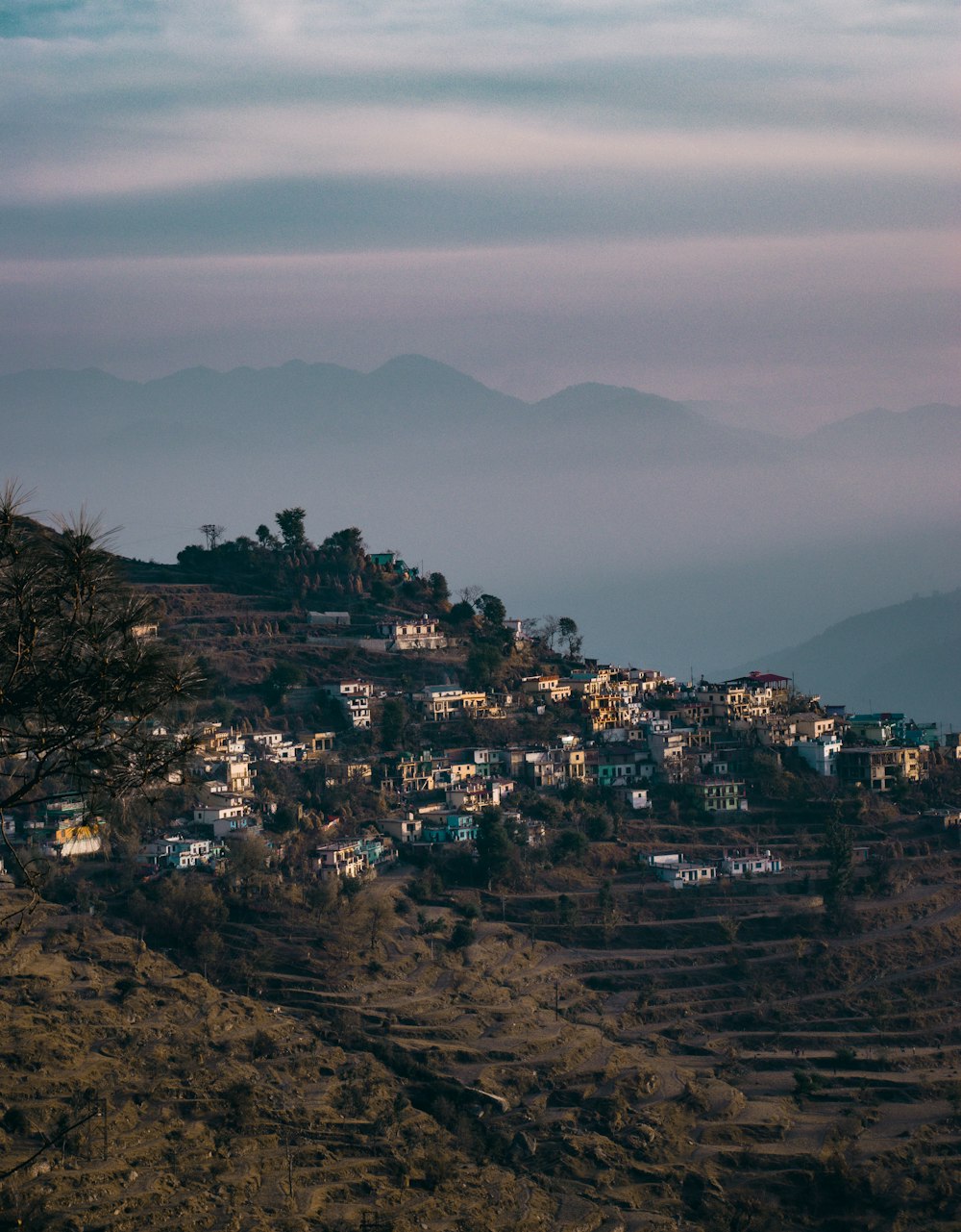 a hill with a village on top of it