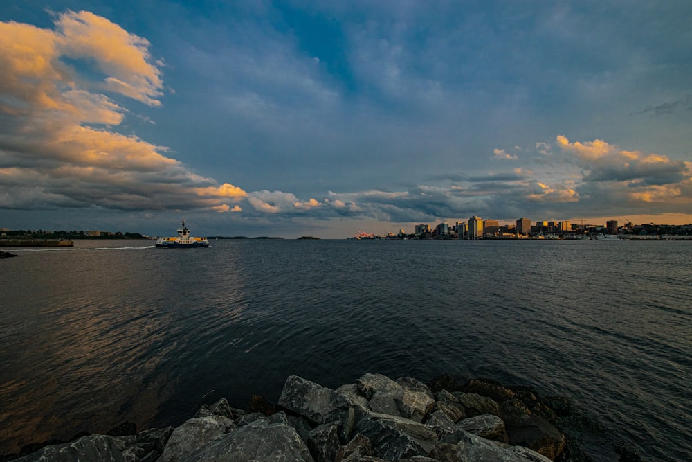 a large body of water under a cloudy sky