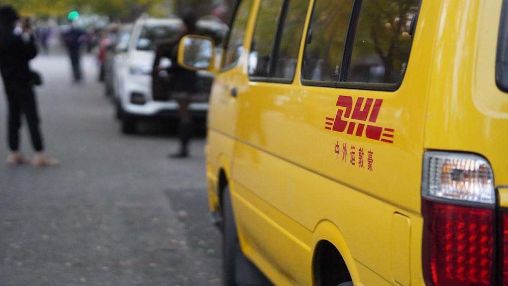 a yellow van parked on the side of a road