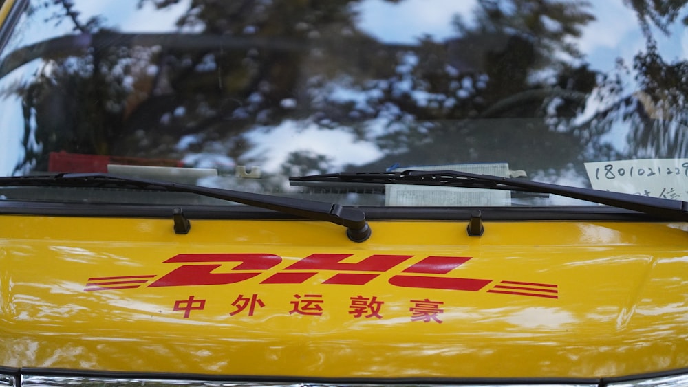 a close up of the back of a yellow vehicle