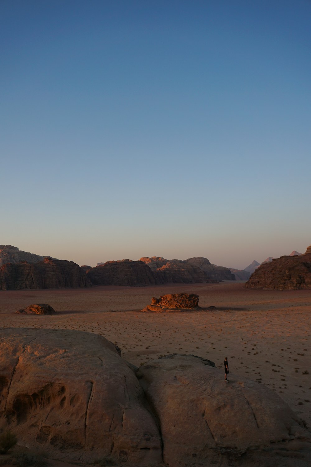 a person standing in the middle of a desert