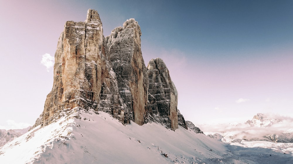 a snow covered mountain with a sky background