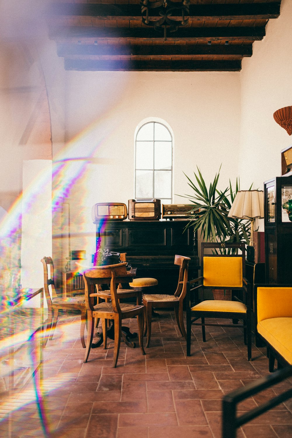 a room filled with furniture and a piano