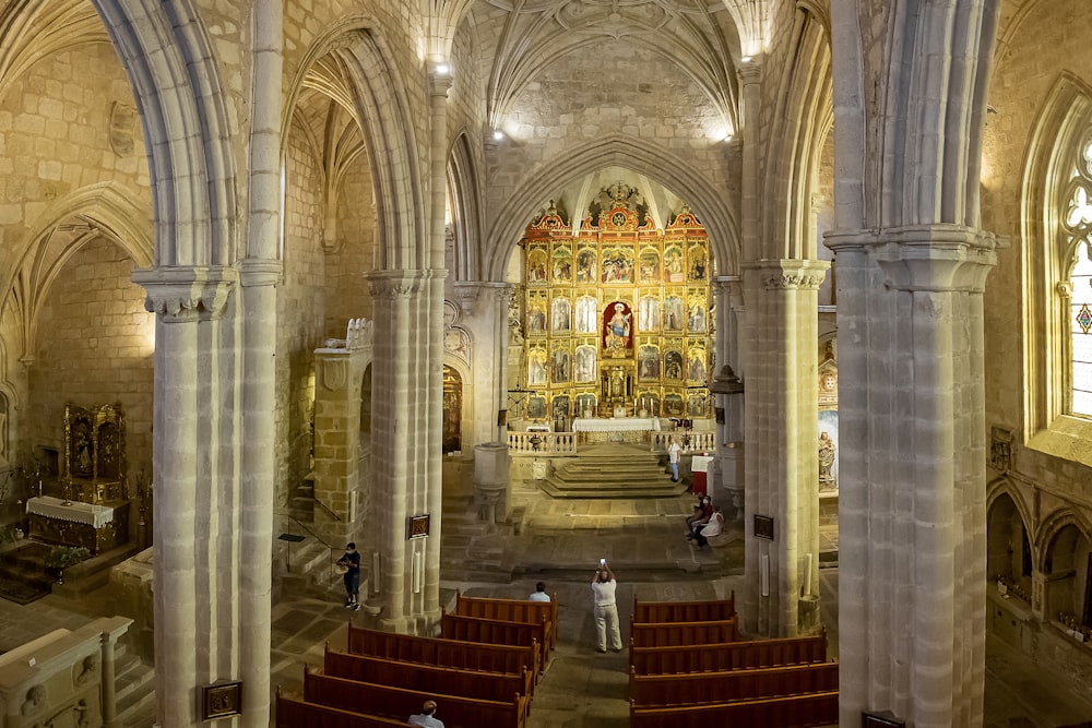 a large cathedral with a lot of people inside of it