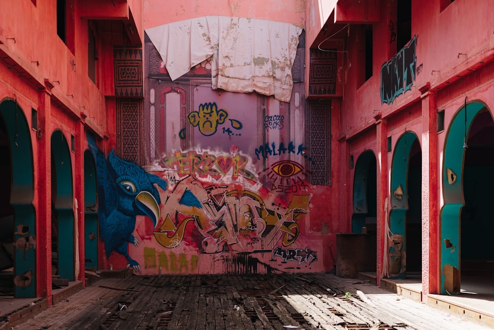 a room with a lot of graffiti on the walls