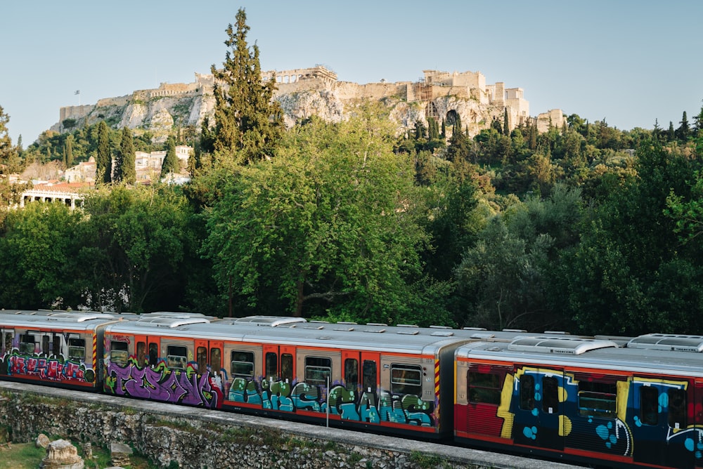 a train with graffiti painted on the side of it
