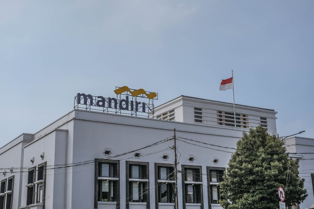 a large white building with a sign on top of it