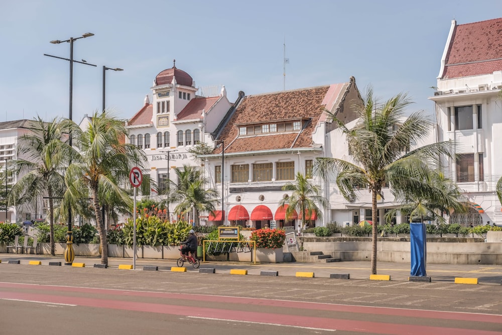 a row of white buildings on a city street