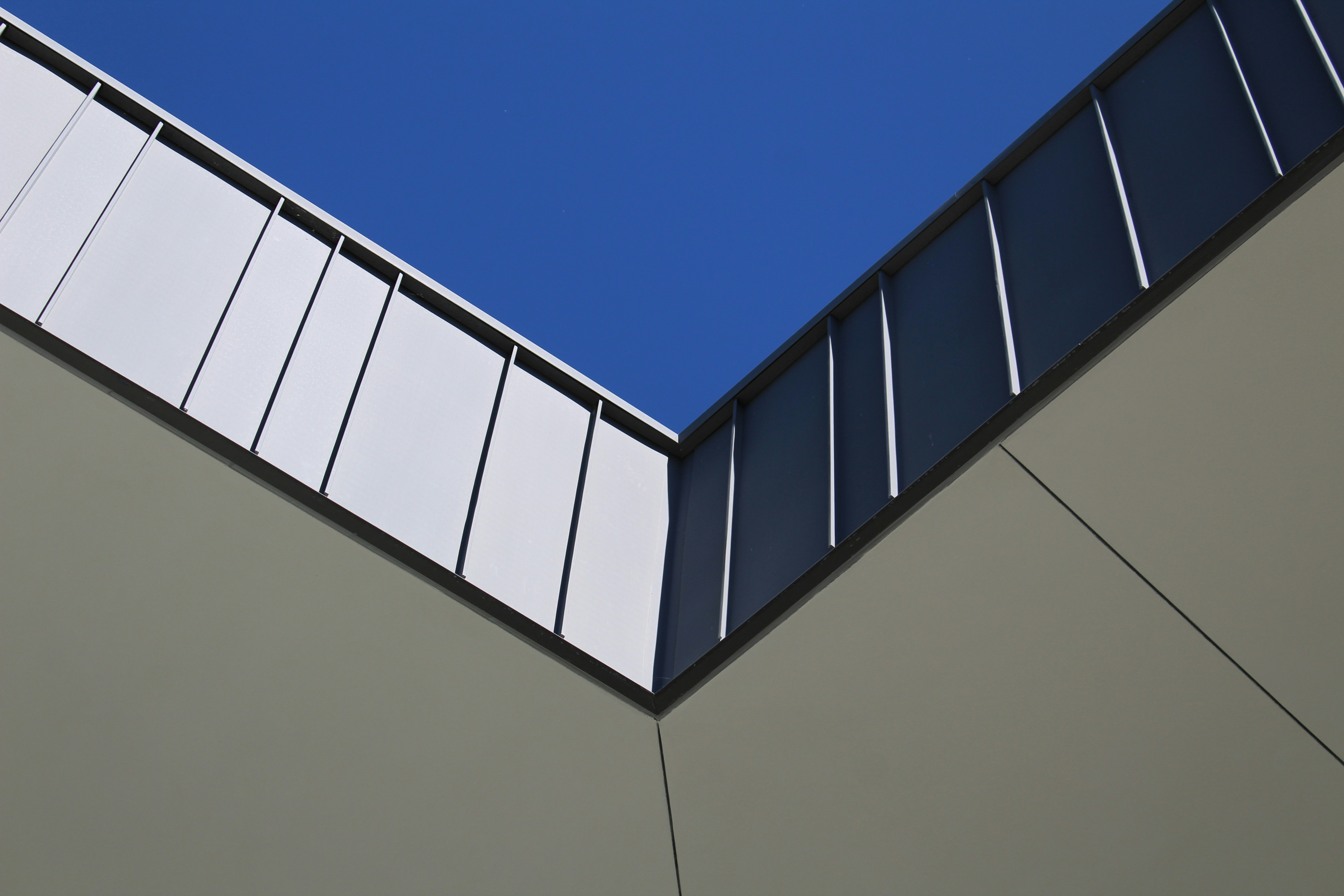 a tall building with a blue sky in the background