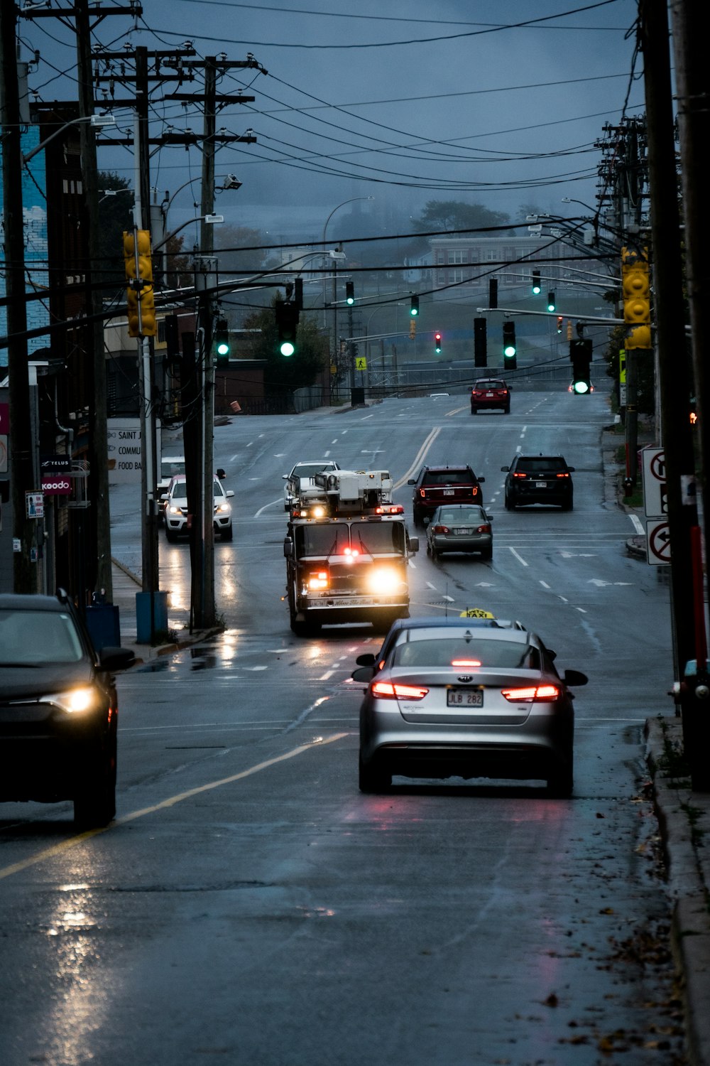 a couple of cars that are sitting in the street