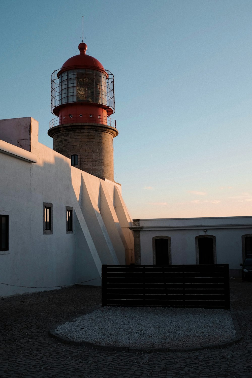 a light house sitting on top of a white building