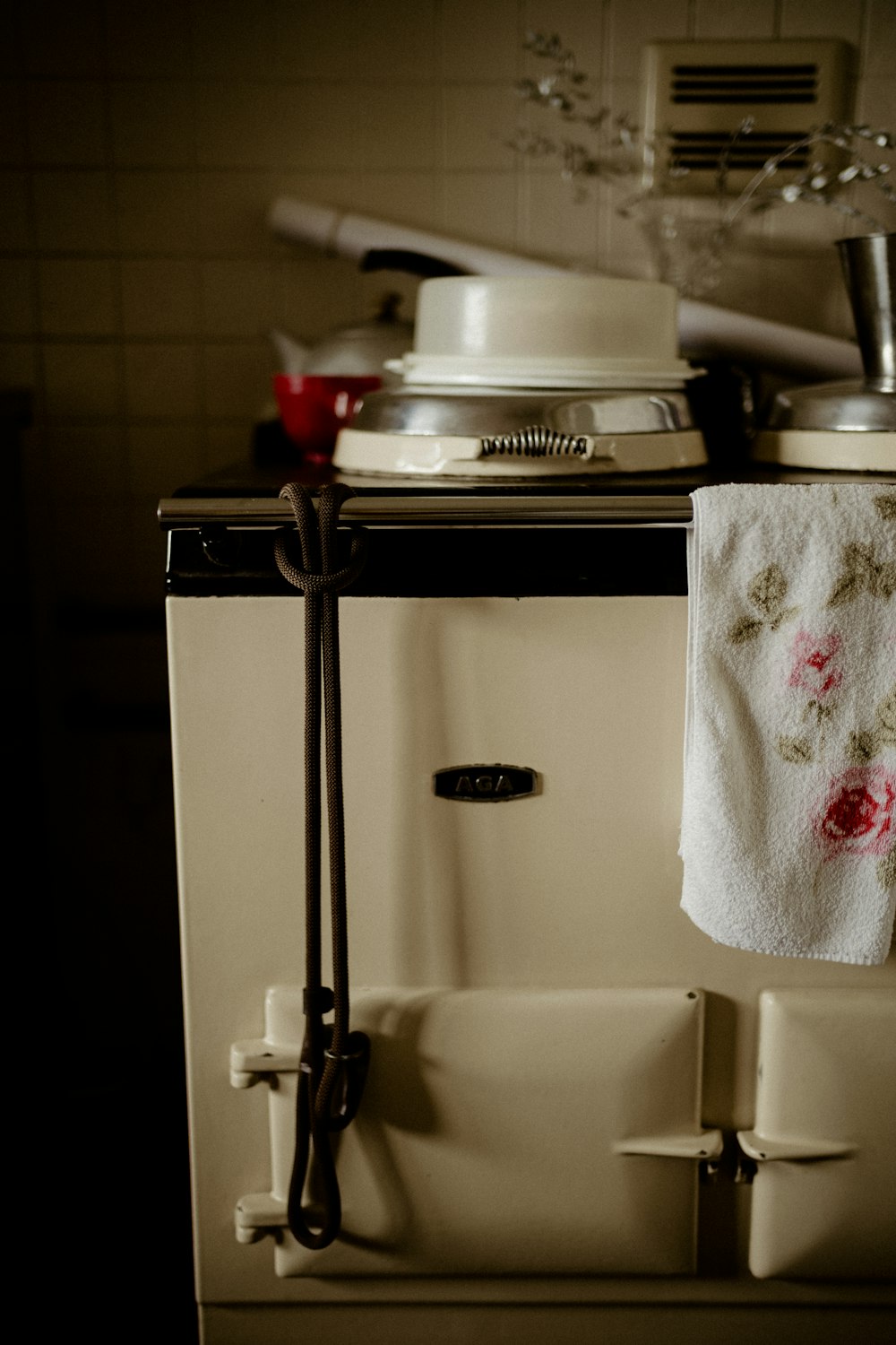 a kitchen stove with a towel hanging from it's side