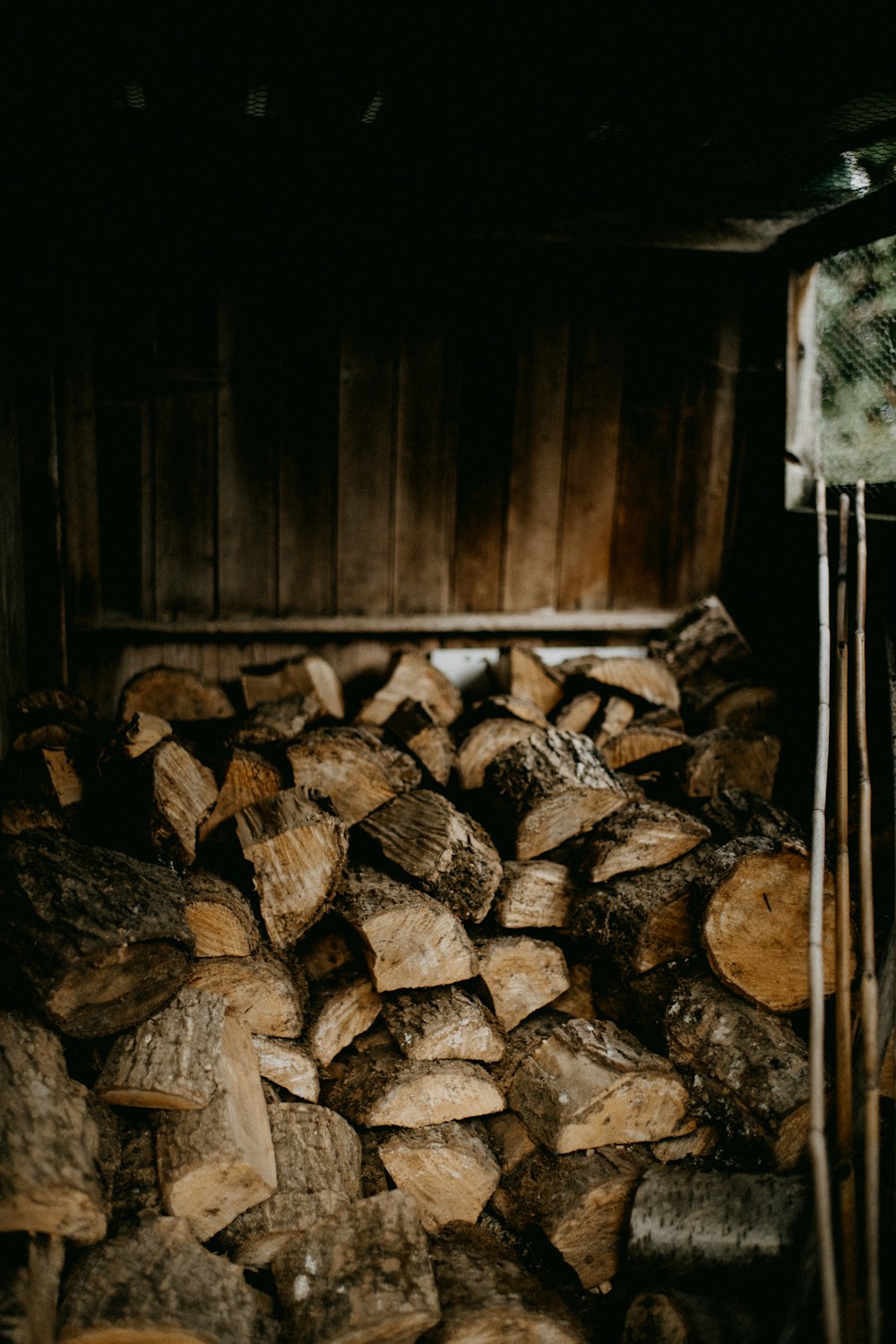 a pile of wood sitting inside of a wooden box