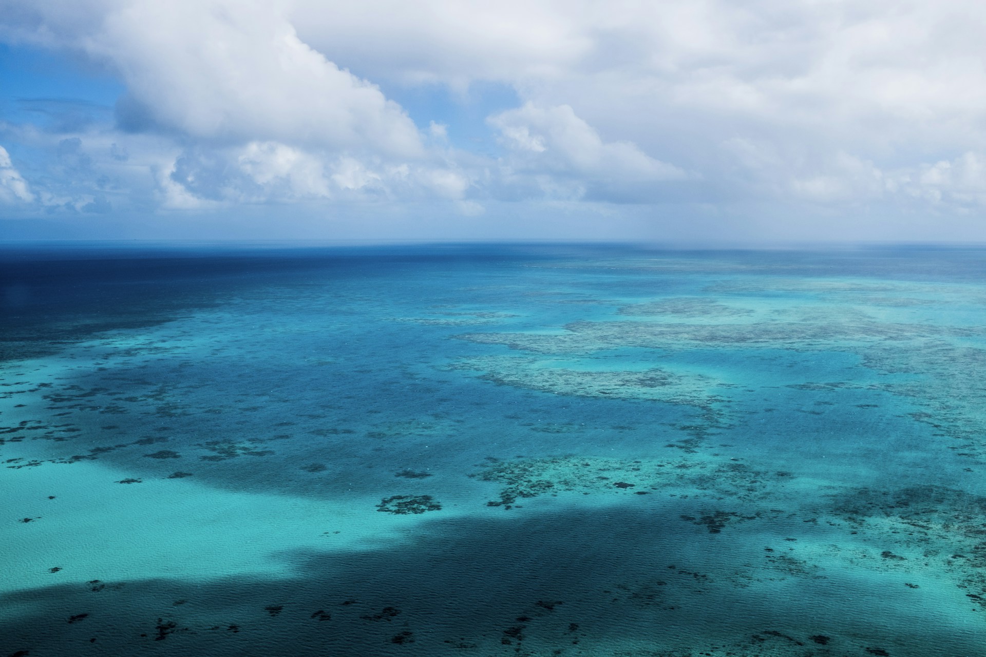 a large body of water surrounded by blue water