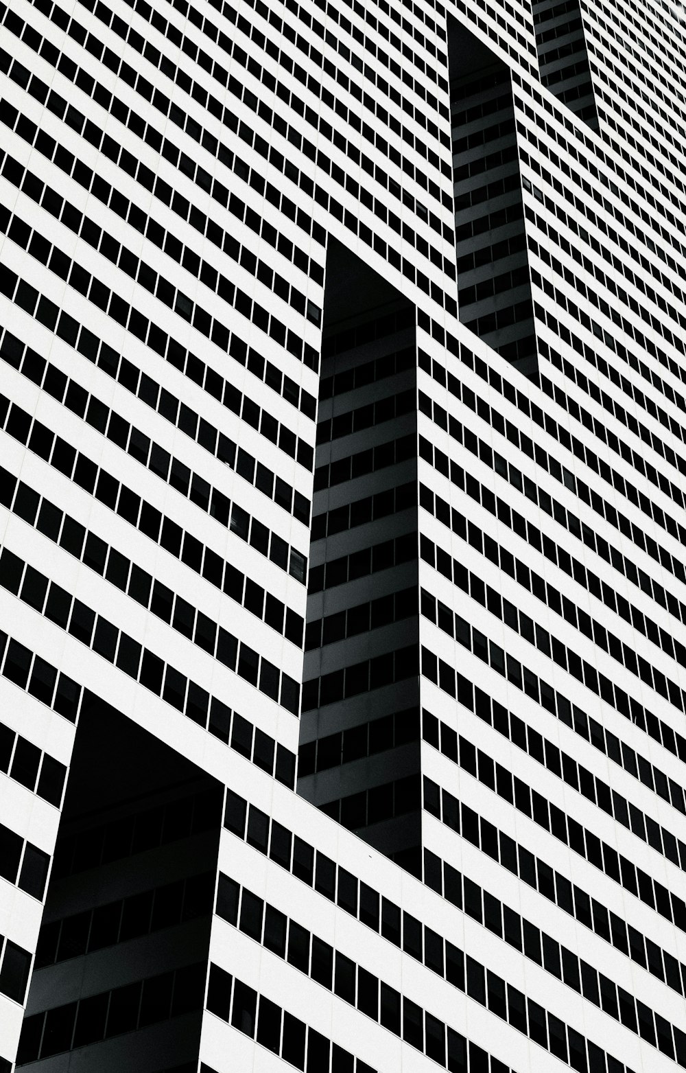 a black and white photo of a tall building